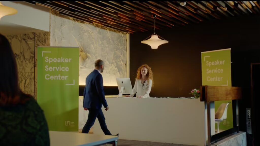 Welcome desk at a Speaker Ready room where a presenter is checking in